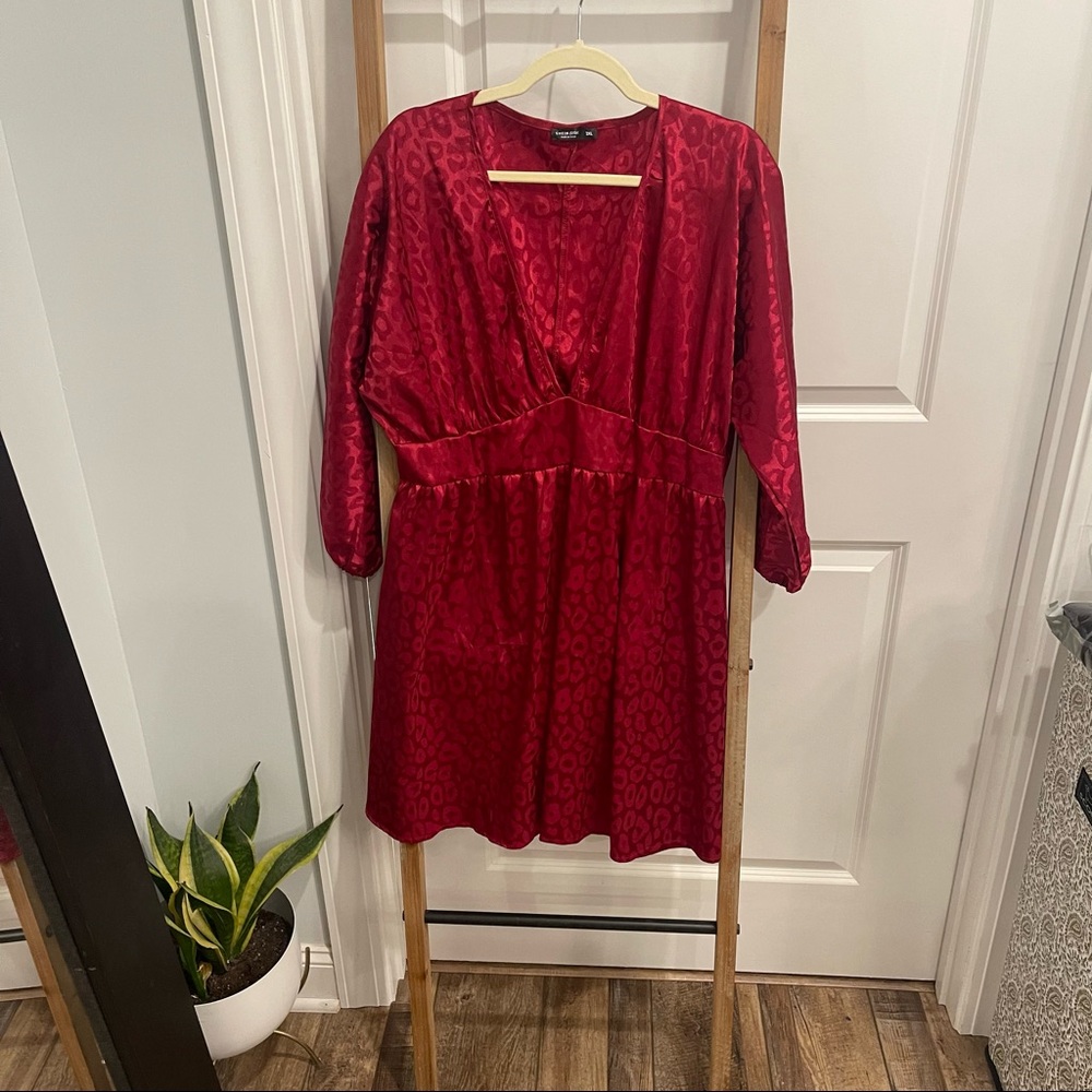 Red satin leopard print dress with plunging neckline